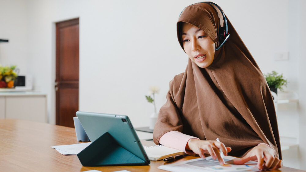 Lady talking to clients online