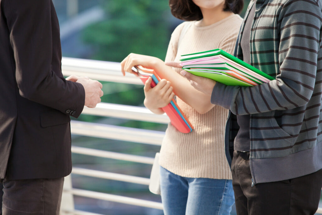 businessman college students discussing education