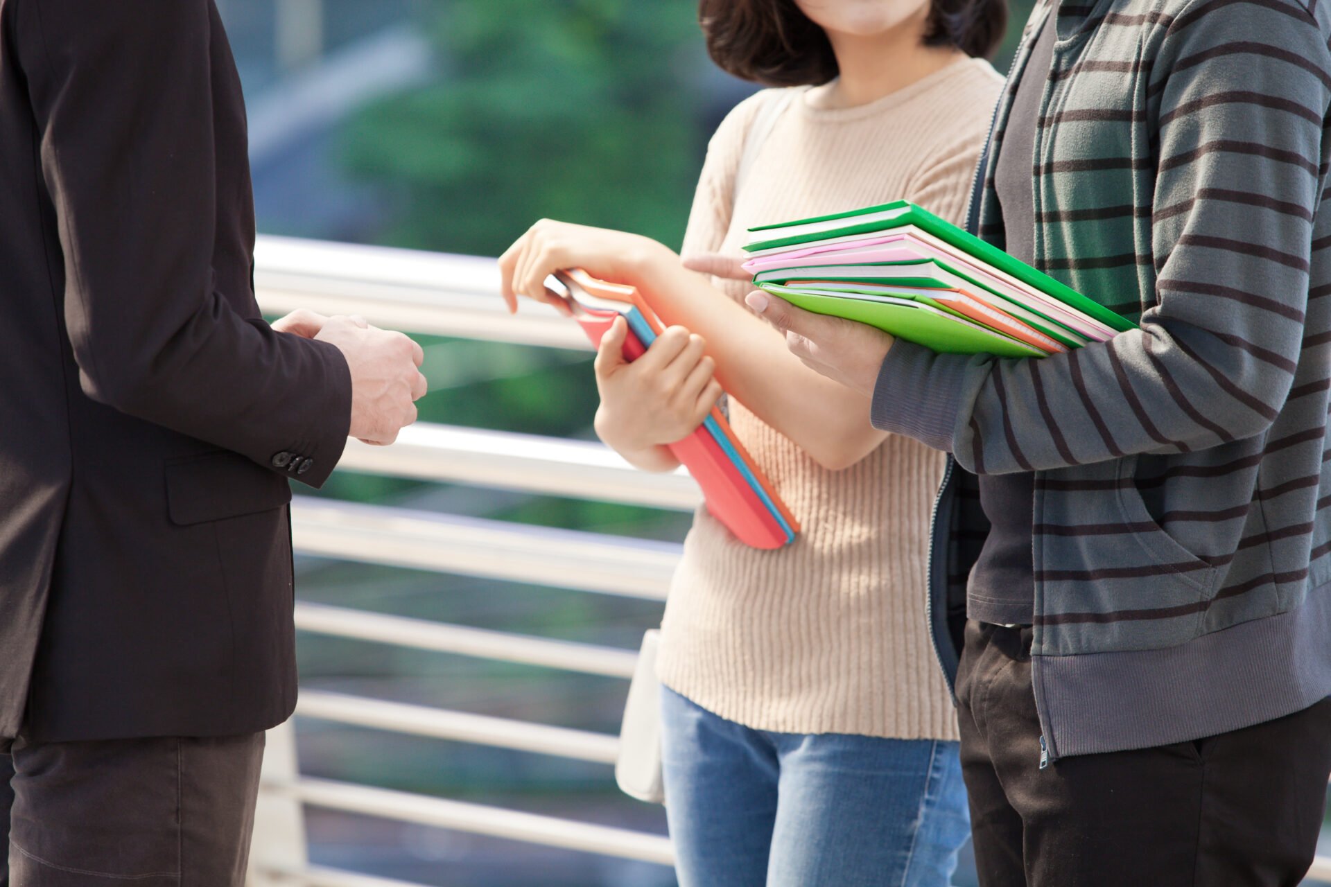 businessman college students discussing education