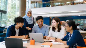 malaysian learners of different ages collaborating in a modern university learning space
